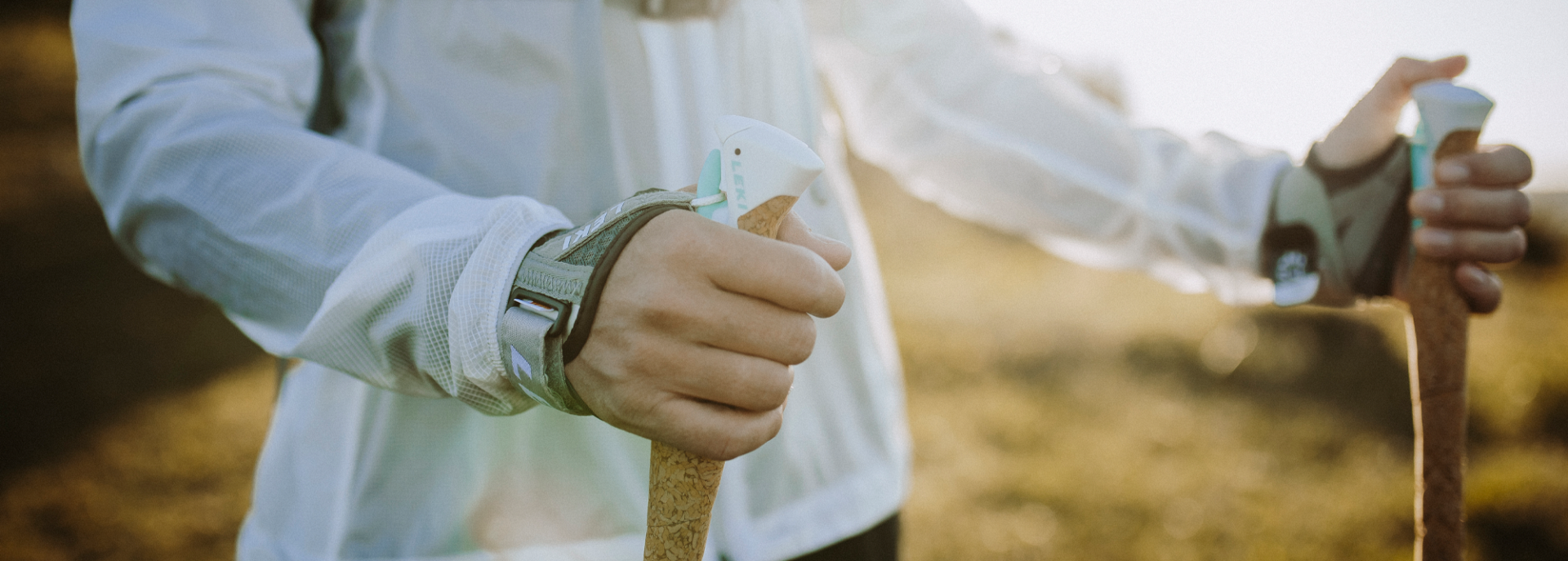 A close of a woman holding leki cross shark poles