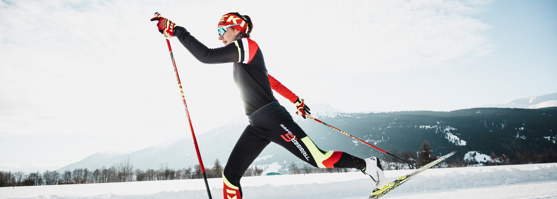 A woman skiing with LEKI poles