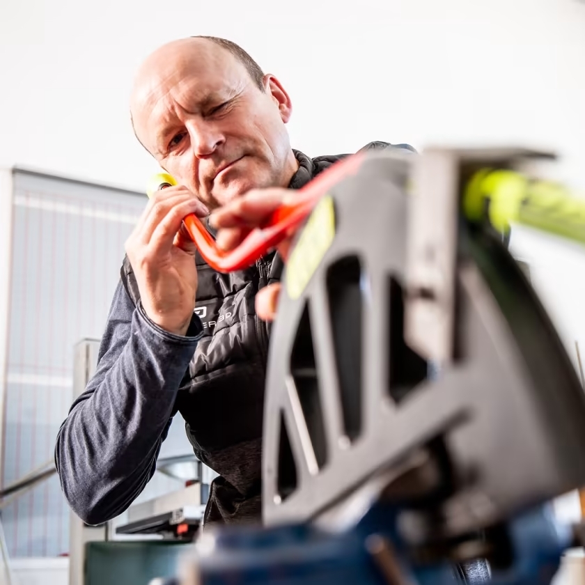 A Leki technician verifying quality