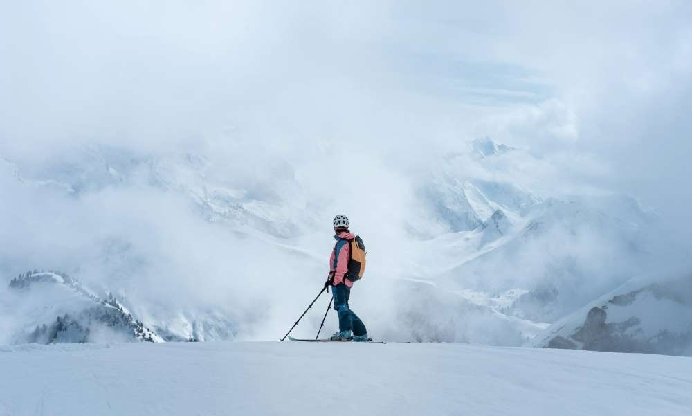 a women at the top of a mountain